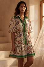 White boho dress with a bird print and bell sleeves, perfect for casual summer outings. 3