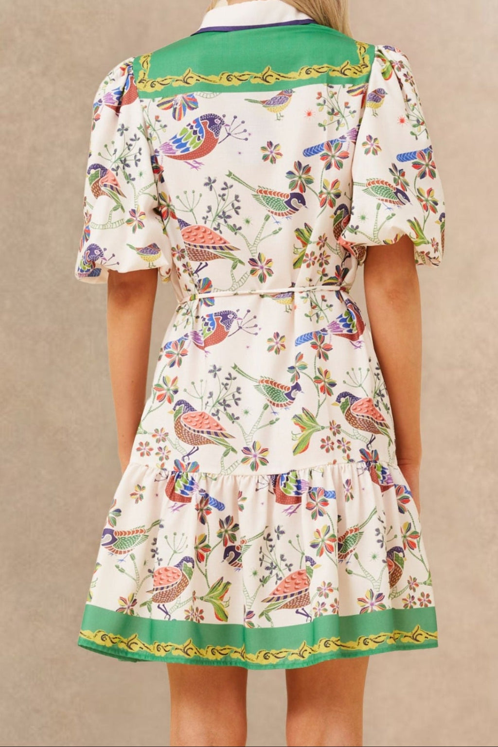 White boho dress with a bird print and bell sleeves, perfect for casual summer outings. 5