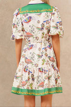 White boho dress with a bird print and bell sleeves, perfect for casual summer outings. 5