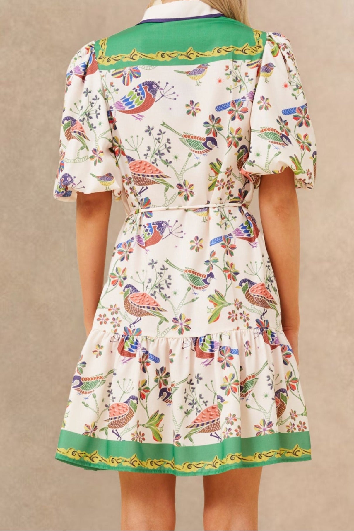 White boho dress with a bird print and bell sleeves, perfect for casual summer outings. 5