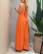 Backless black jumpsuit with cut-out waist and tie-back detail, featuring a stylish lantern silhouette. 8