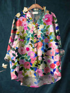 Light blue floral linen blouse with a relaxed fit and short sleeves. 0