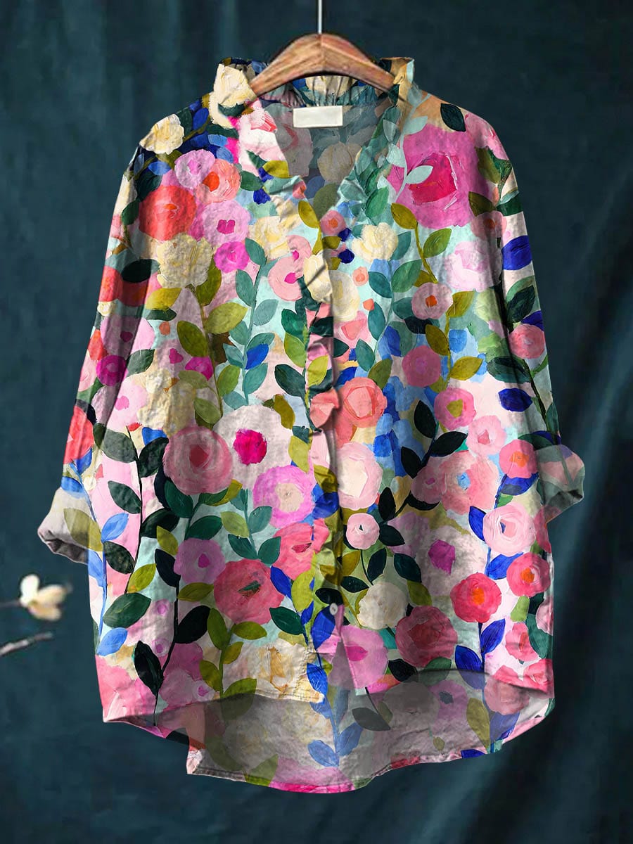 Light blue floral linen blouse with a relaxed fit and short sleeves. 0