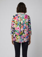 Light pink floral print blouse with ruffled collar, featuring a relaxed fit and made from soft linen. 3