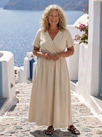 A flowing, navy blue midi dress with a floral print and short sleeves, perfect for casual outings. 1