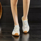 Lightweight black running sneakers with a sleek, modern design and breathable mesh upper. 7