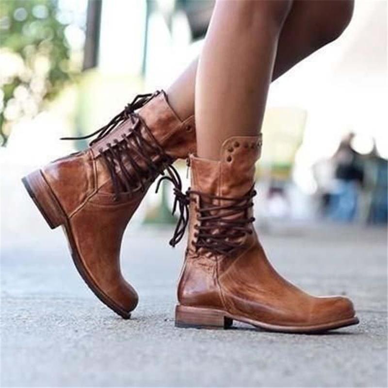 Stylish black ankle boots with a sleek design and subtle embellishments. 1