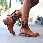 Stylish black ankle boots with a sleek design and subtle embellishments. 1
