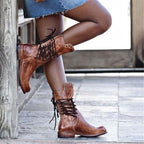 Stylish black ankle boots with a sleek design and subtle embellishments. 2