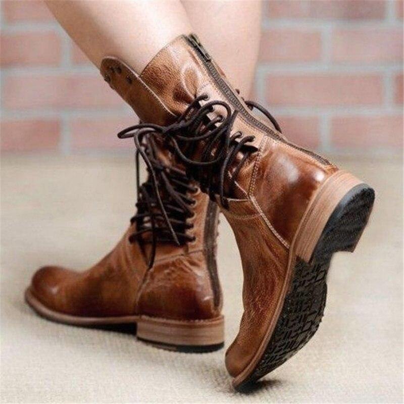 Stylish black ankle boots with a sleek design and subtle embellishments. 3