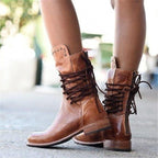 Stylish black ankle boots with a sleek design and subtle embellishments. 4