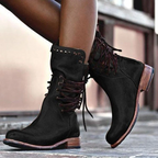 Stylish black ankle boots with a sleek design and subtle embellishments. 5