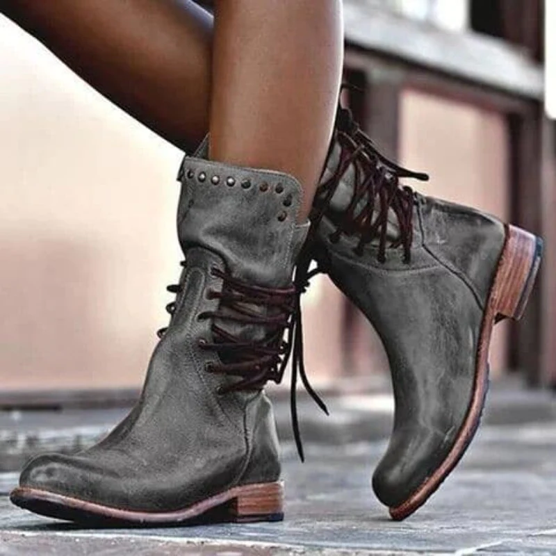 Stylish black ankle boots with a sleek design and subtle embellishments. 6