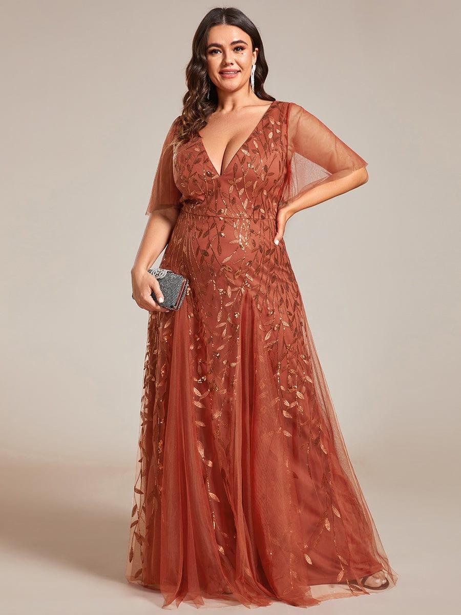 Plus size evening gown with a deep V-neck and a sequinned leaf pattern over tulle.