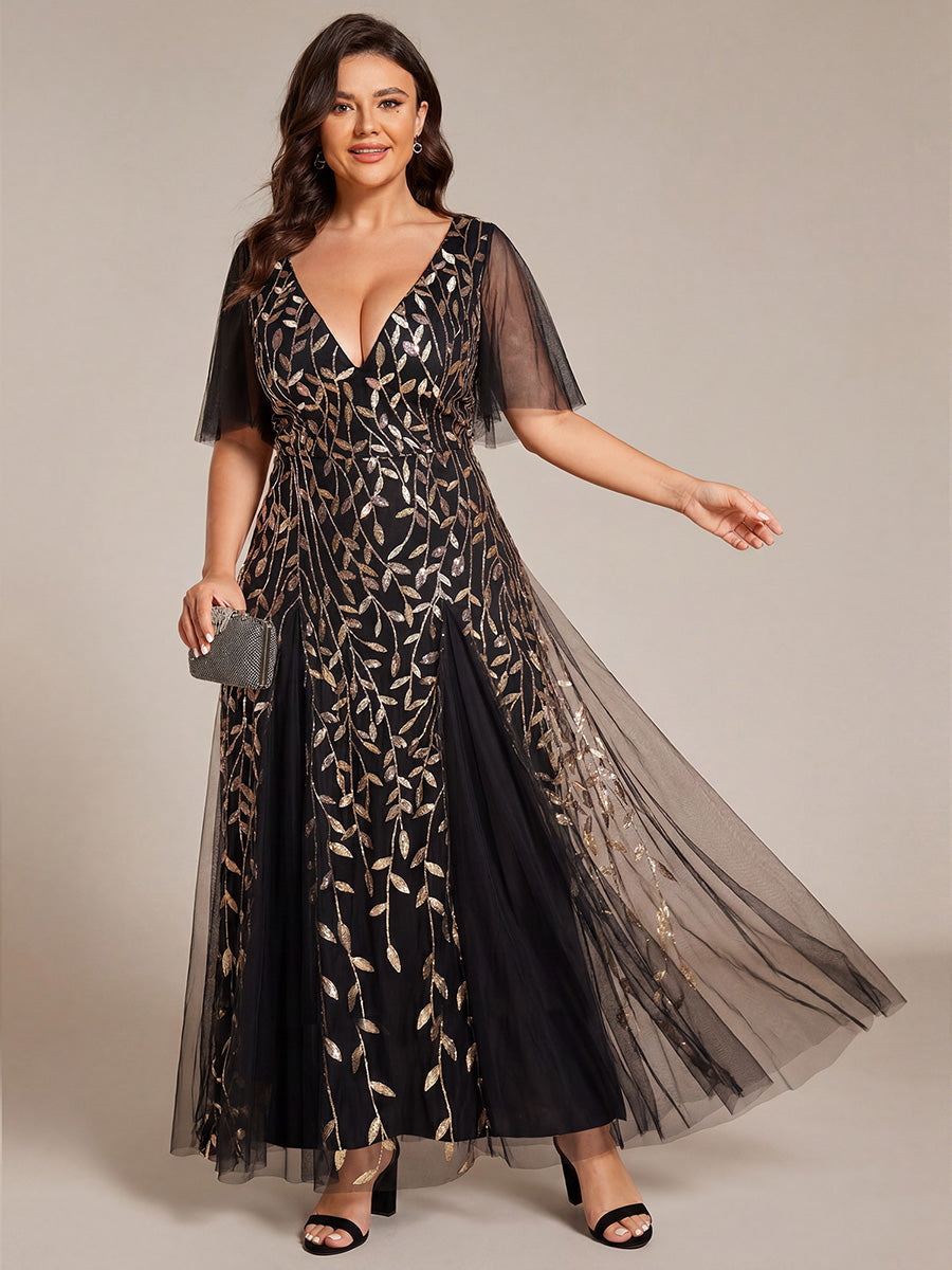 Plus size evening gown with a deep V-neck and a sequinned leaf pattern over tulle.