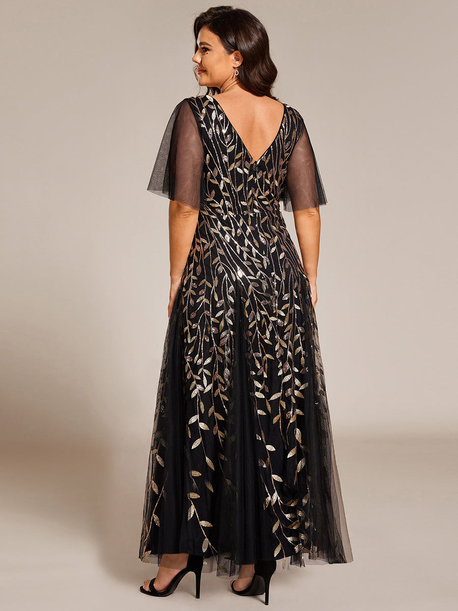 Plus size evening gown with a deep V-neck and a sequinned leaf pattern over tulle.