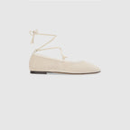 Off-white ballet flats with ankle tie detail and soft-square toe design. 0
