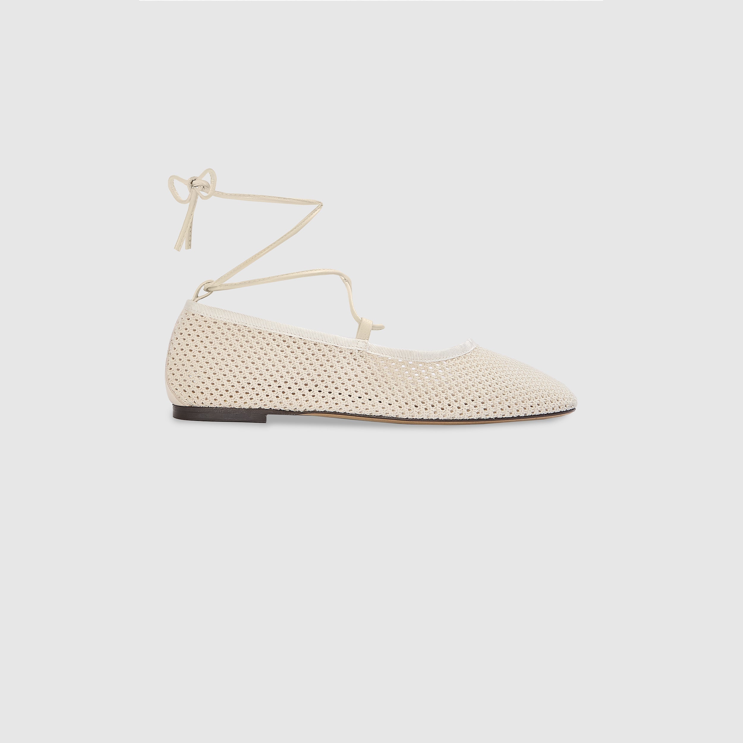 Off-white ballet flats with ankle tie detail and soft-square toe design. 0
