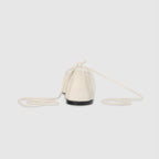 Off-white ballet flats with ankle tie detail and soft-square toe design. 2