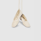 Off-white ballet flats with ankle tie detail and soft-square toe design. 4