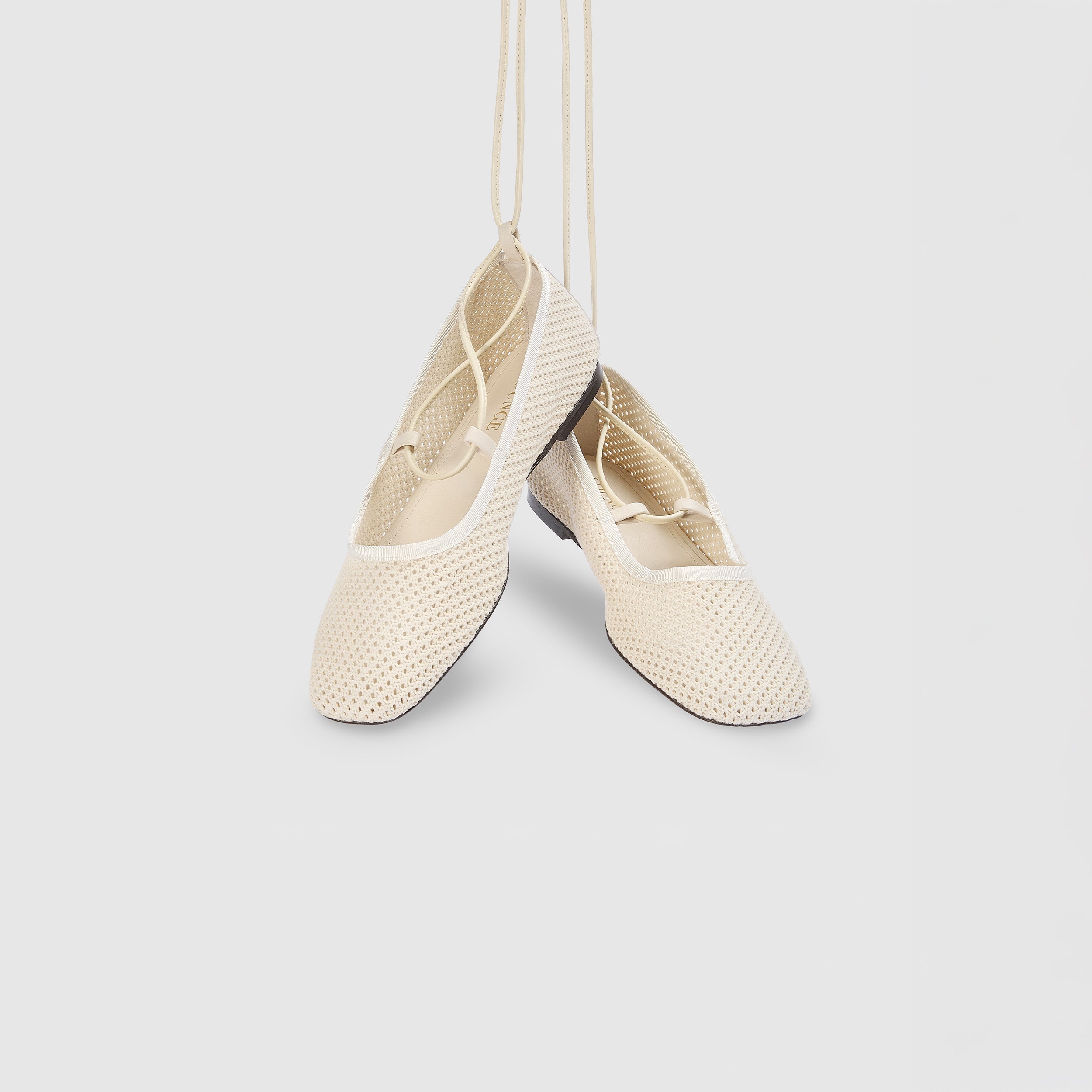 Off-white ballet flats with ankle tie detail and soft-square toe design. 4