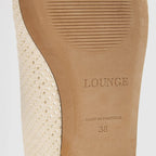Off-white ballet flats with ankle tie detail and soft-square toe design. 5
