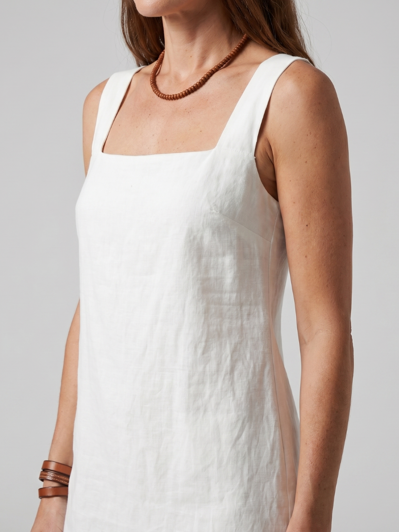 Azure mini dress with a square neckline and tailored fit, perfect for summer outings. 2