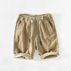 Light gray casual cotton shorts featuring a relaxed fit and adjustable drawstring. 0