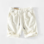 Light gray casual cotton shorts featuring a relaxed fit and adjustable drawstring. 2