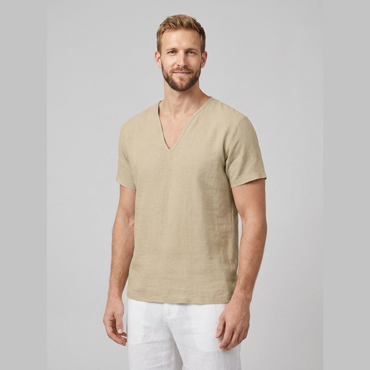Relaxed fit men's t-shirt in light blue, made from breathable linen, featuring a v-neck and short sleeves. 1