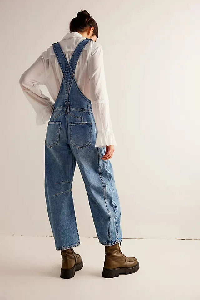 Blue denim overalls with a relaxed fit and adjustable straps, perfect for casual, everyday wear. 4