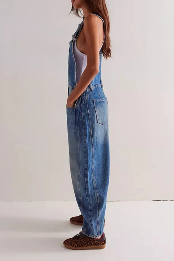 Blue denim overalls with a relaxed fit and adjustable straps, perfect for casual, everyday wear. 6