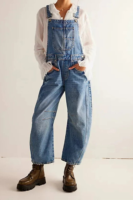 Blue denim overalls with a relaxed fit and adjustable straps, perfect for casual, everyday wear. 7