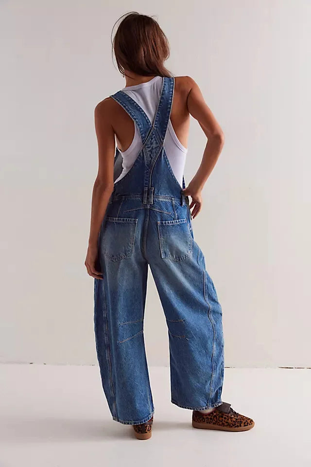 Blue denim overalls with a relaxed fit and adjustable straps, perfect for casual, everyday wear. 8