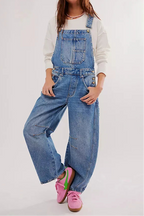 Blue denim overalls with a relaxed fit and adjustable straps, perfect for casual, everyday wear. 9
