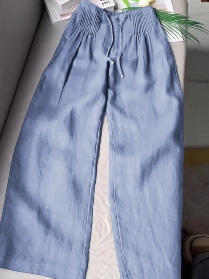 Beige wide-leg pants made from a cotton-linen blend, featuring a relaxed fit for comfort and breathability. 3