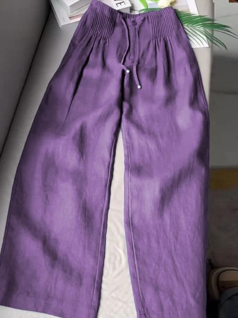 Beige wide-leg pants made from a cotton-linen blend, featuring a relaxed fit for comfort and breathability. 5