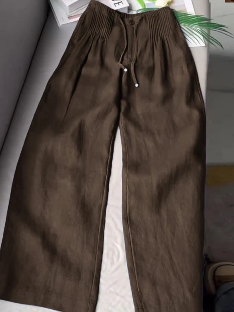 Beige wide-leg pants made from a cotton-linen blend, featuring a relaxed fit for comfort and breathability. 6