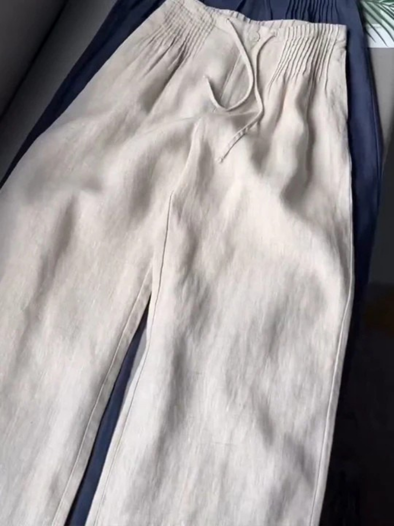 Beige wide-leg pants made from a cotton-linen blend, featuring a relaxed fit for comfort and breathability. 7