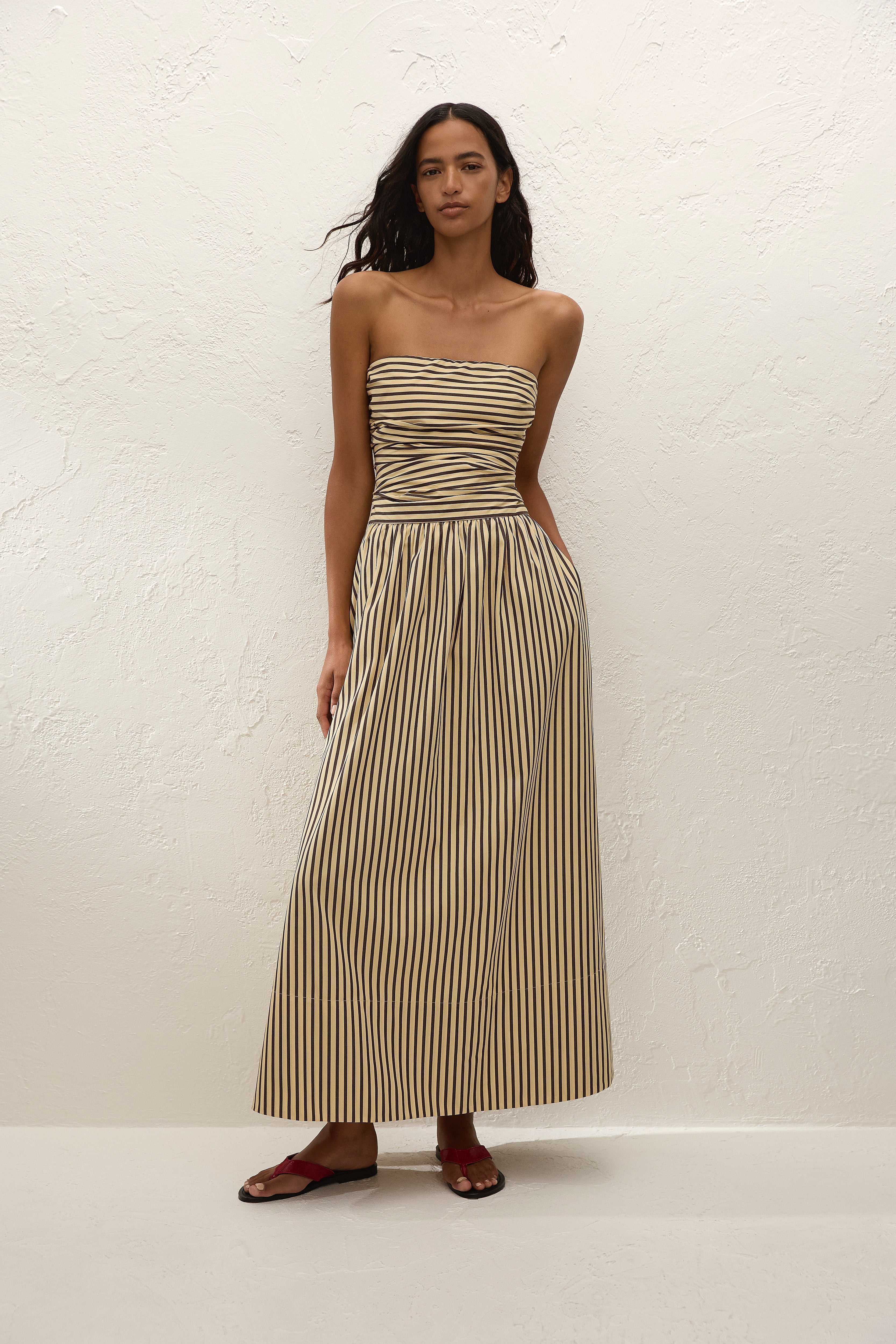 Sleeveless maxi dress in sand with striped pattern, perfect for summer casual wear. 0