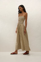 Sleeveless maxi dress in sand with striped pattern, perfect for summer casual wear. 2