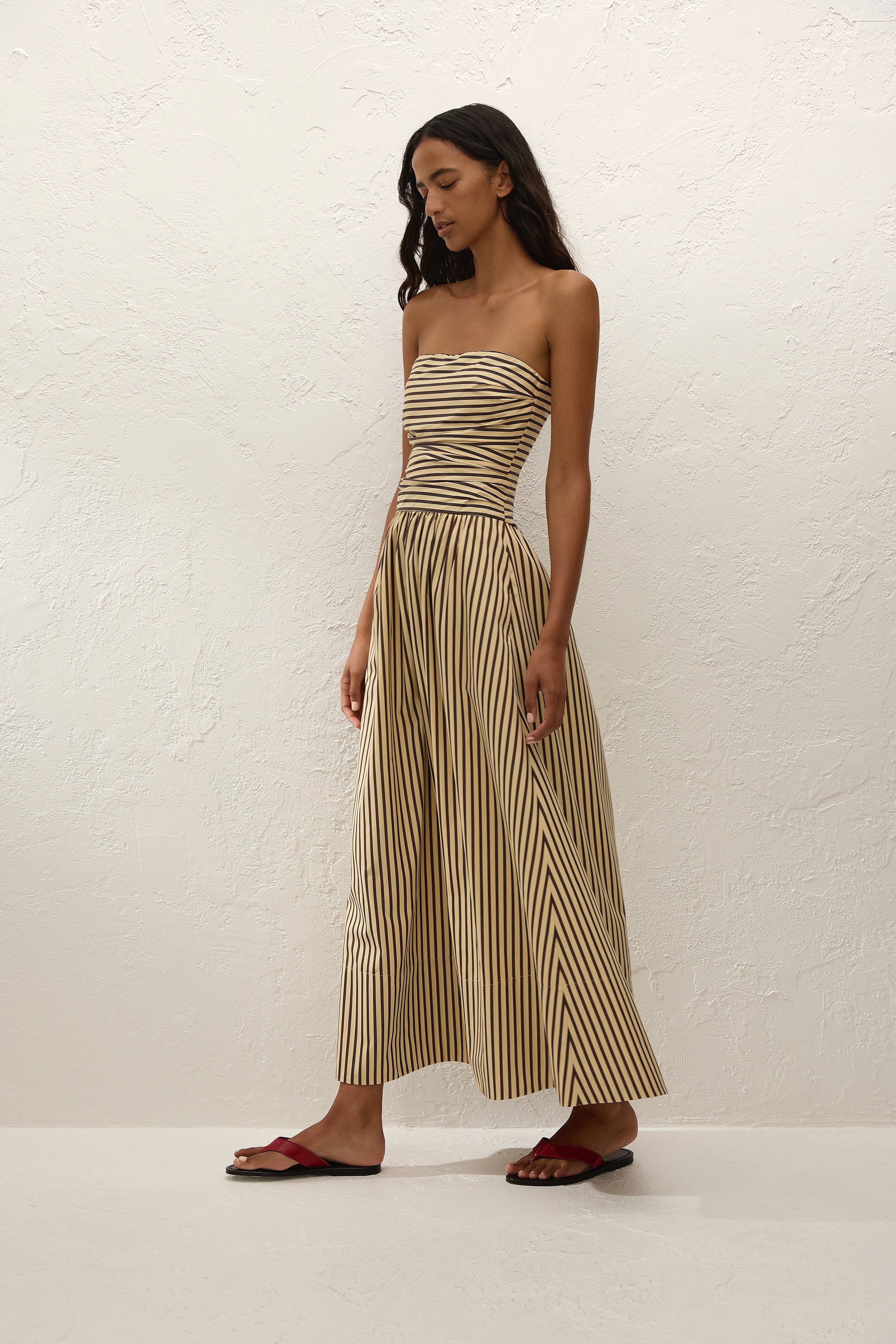 Sleeveless maxi dress in sand with striped pattern, perfect for summer casual wear. 2