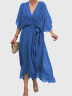 Cassandra women's dress in soft lavender, featuring a V-neck and a flattering silhouette, perfect for weddings. 2