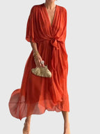 Cassandra women's dress in soft lavender, featuring a V-neck and a flattering silhouette, perfect for weddings. 9