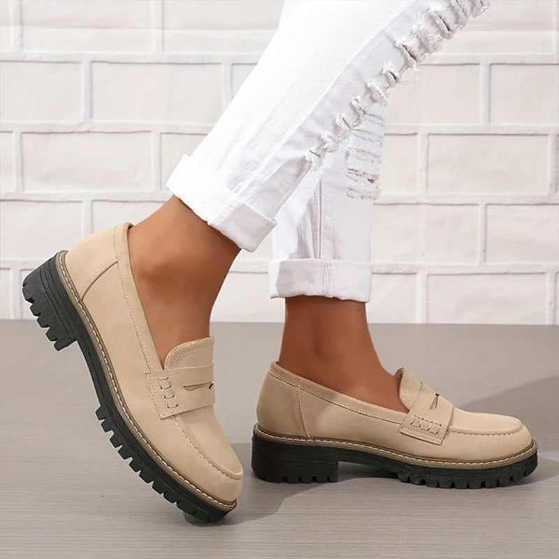 Soft blue moccasins with an ergonomic sole and wedge design, offering a casual and comfortable style. 3
