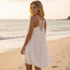 Lightweight mini beach cover-up dress in soft white, featuring a relaxed O-neckline and sleeveless design. 0
