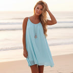 Lightweight mini beach cover-up dress in soft white, featuring a relaxed O-neckline and sleeveless design. 2