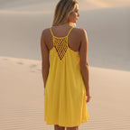 Lightweight mini beach cover-up dress in soft white, featuring a relaxed O-neckline and sleeveless design. 3