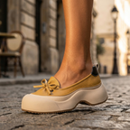 Clara cushioned support shoes in soft beige vegan leather, featuring a sleek and minimalist design for everyday wear. 6