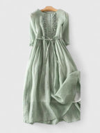Light blue linen blend midi dress with adjustable waist, featuring a relaxed fit and casual style for women. 0